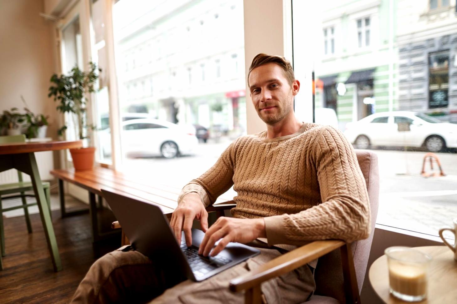 Person analyzing financial data on computer with investment charts